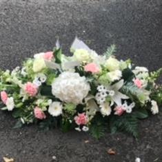 Pink and white casket spray