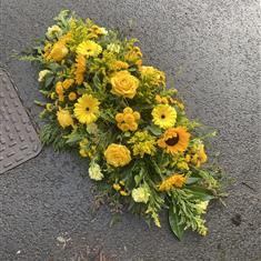 Yellow casket spray
